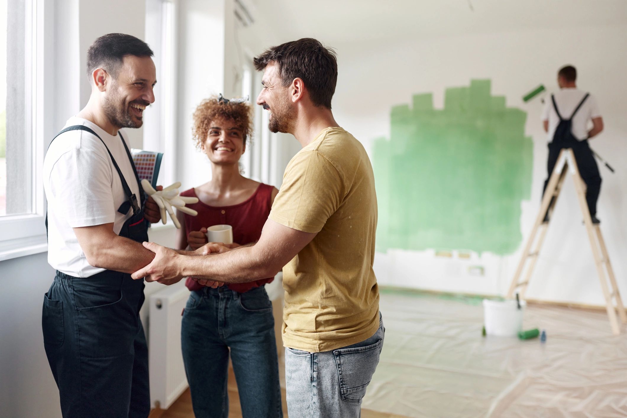 Homeowner and contractor reviewing renovation agreement