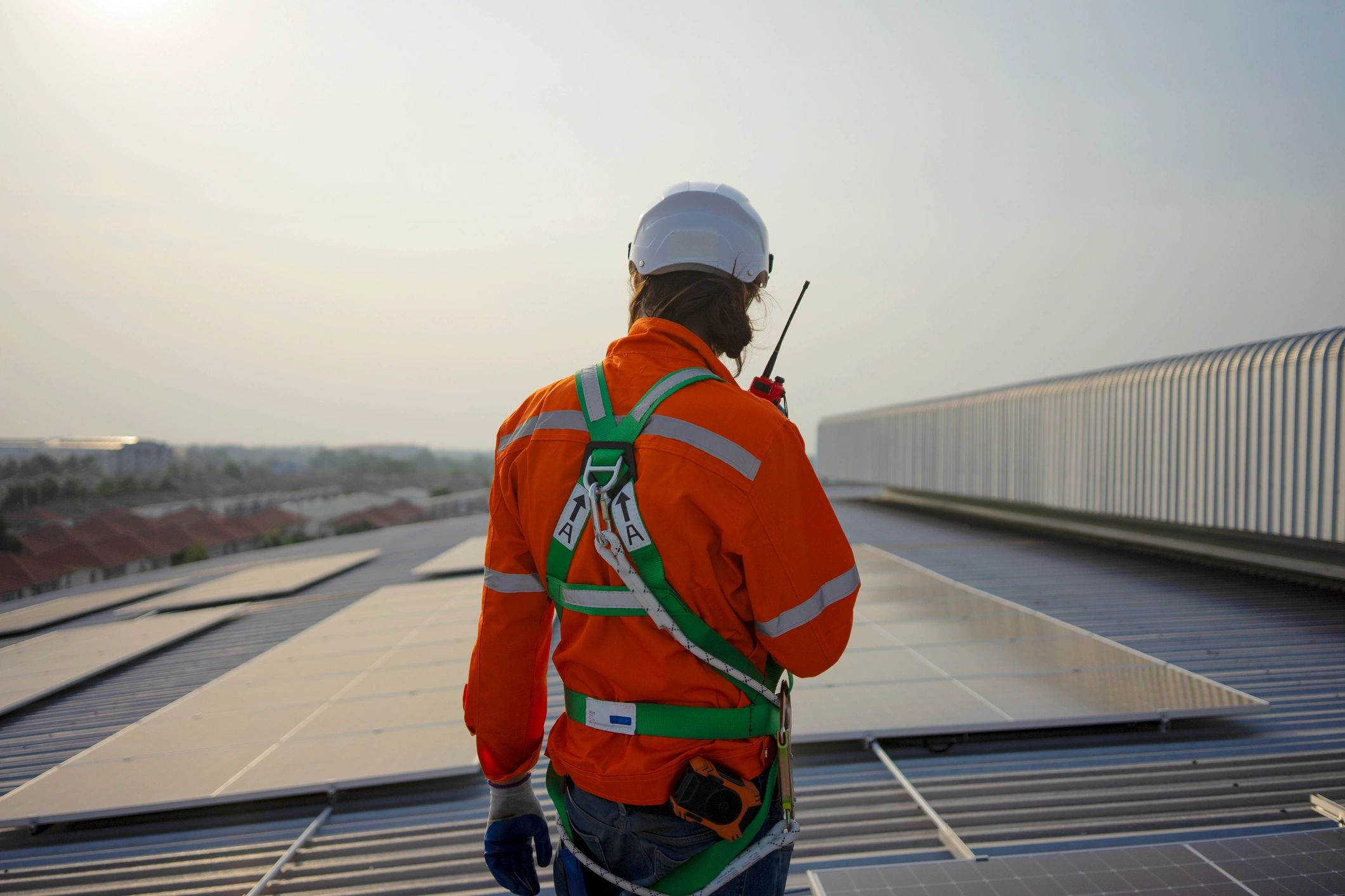 Contractor working on rooftop representing municipal facility repair planning