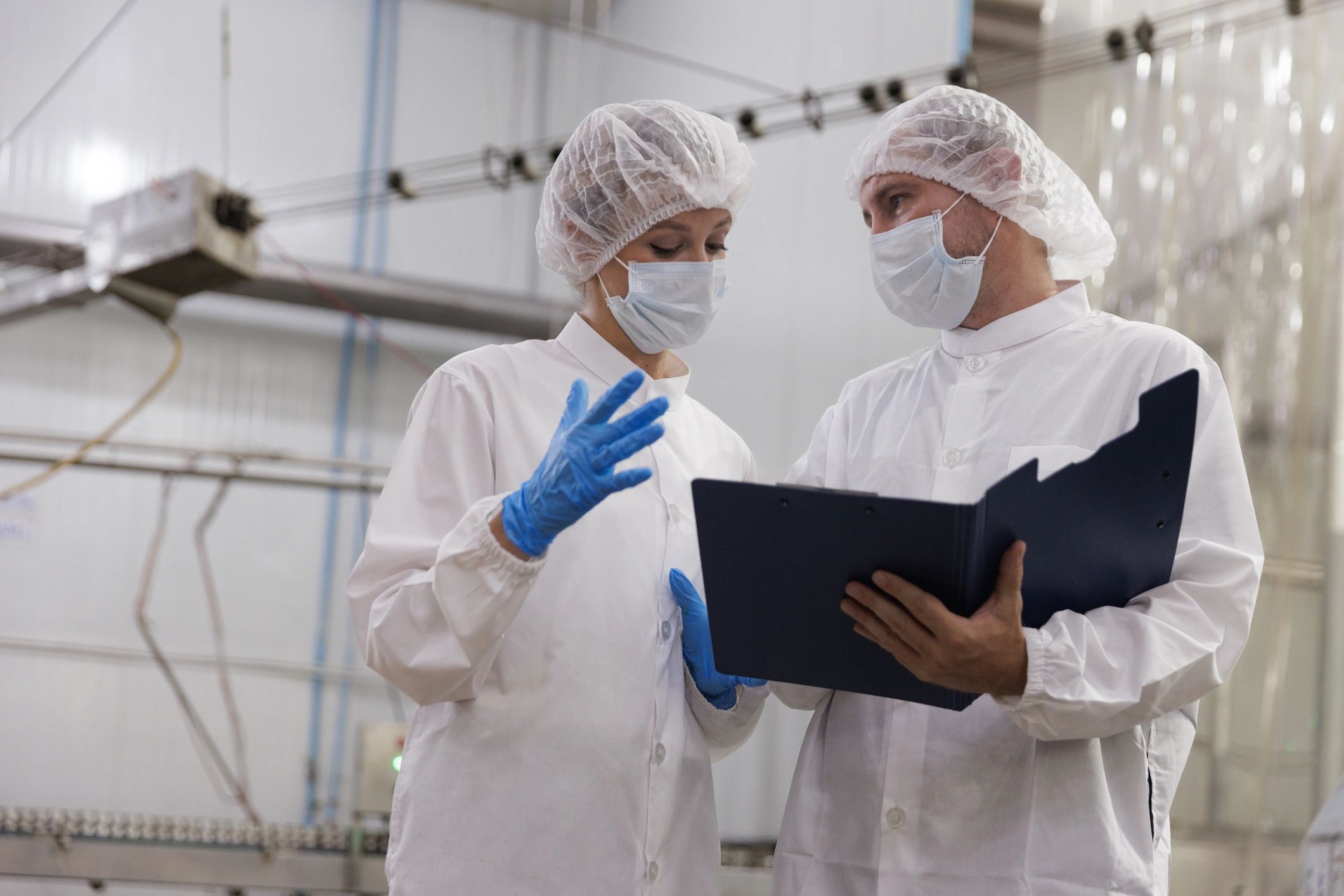 Protective-gear professionals reviewing procedures in a controlled environment